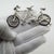 This vintage silver figurative sculpture depicts a tandem bicycle, crafted as a desktop novelty, cabinet curiosity, or...
