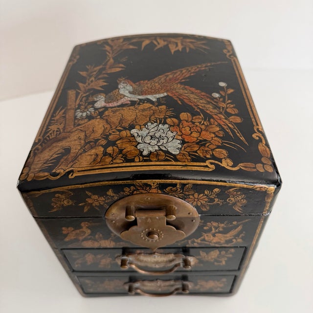 Asian vintage lacquered kodansu box with floral and bird decoration in gold. Interesting stitched wrap detailing to sides....