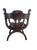 Renaissance Revival Savonarola-style carved wooden chair with a lion motif. Manufactured in the early 20th century using...