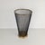 This umbrella stand, designed in the style of Mathieu Matégot in the 1950s, features a black metal mesh frame and a gold-...