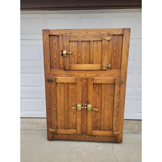 1930's vintage antique rustic solid oak wood ice chest box. Three compartments. Bottom cabinets have two sleeves on each...