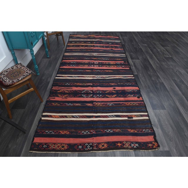 Vintage Hand-Knotted area rug is a semi-antique vintage area rug. The '70s Eastern region of Anatolia's unique rug is...