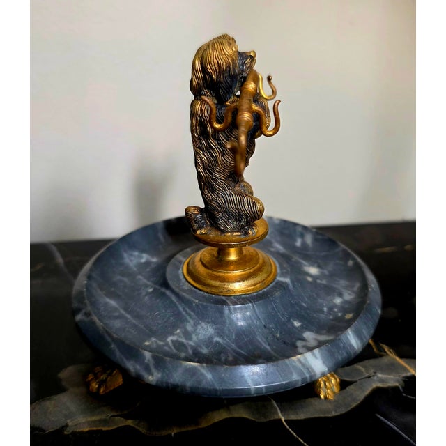 This item is a 19th-century Victorian novelty figural pocket watch stand and vide-poche (trinket tray).The piece features...