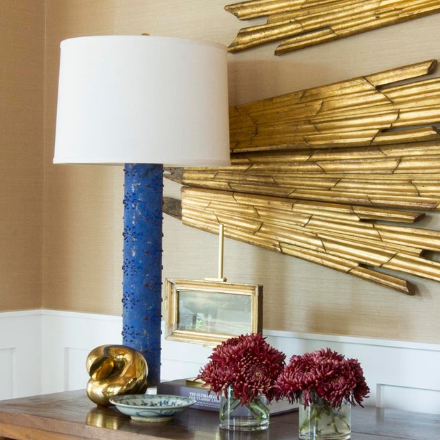 This vintage table lamp is built from a repurposed wallpaper print roller and will make a statement in any room. It sits...