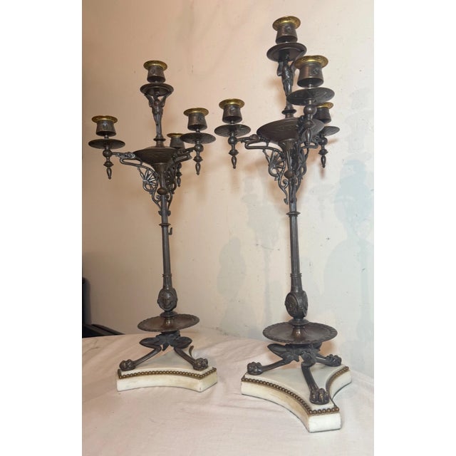 Up for sale is a very large pair of high quality antique 19th century solid bronze figural candelabra. They're cast with...