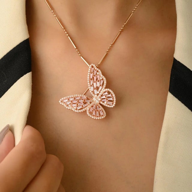 Elevate your style with this dazzling butterfly brooch, meticulously crafted in 925 sterling silver and finished in a warm...