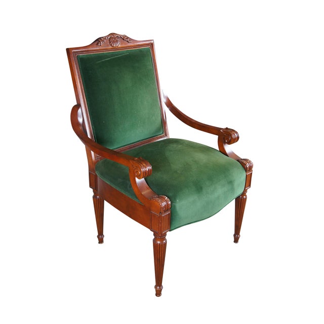 Late 20th Century French Empire Style Upholstered Arm Chair. Made from birch with a high back featuring a scalloped crest...