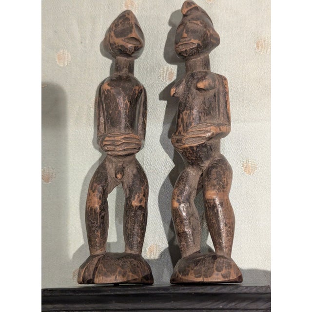 Originating from West Africa, these figures were certified as Senufo "pombibele" used in Poro society, or Bamana "jo...
