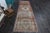 Vintage Hand-Knotted runner rug is a semi-antique vintage runner rug. The '70s Eastern region of Anatolia's unique rug is...