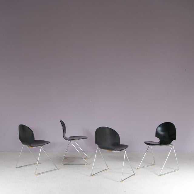 A beautiful set of four stacking chairs designed by lawrence minsker, manufactured by fritz hansen in denmark in the...