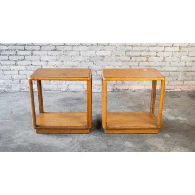 Edward Wormley for Dunbar end or side tables in amber mahogany, circa 1950s. Rectangular open frame with rounded edges and...