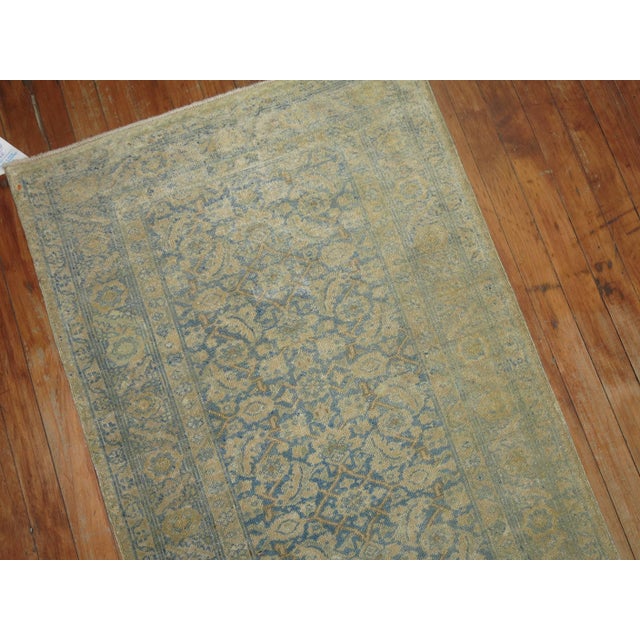 Finely woven narrow and long Persian Tabriz runner in very pale blues and gold, circa 1910, measures: 2'4" x 13'9".