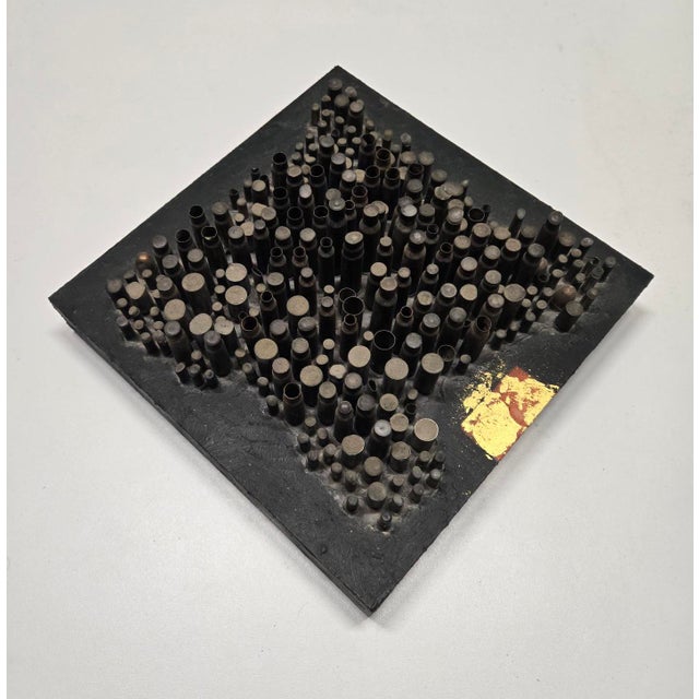 This work by Santa Fe and Portland artist Trina Badarak consists of about four hundred bullet casings filled with wax! I...