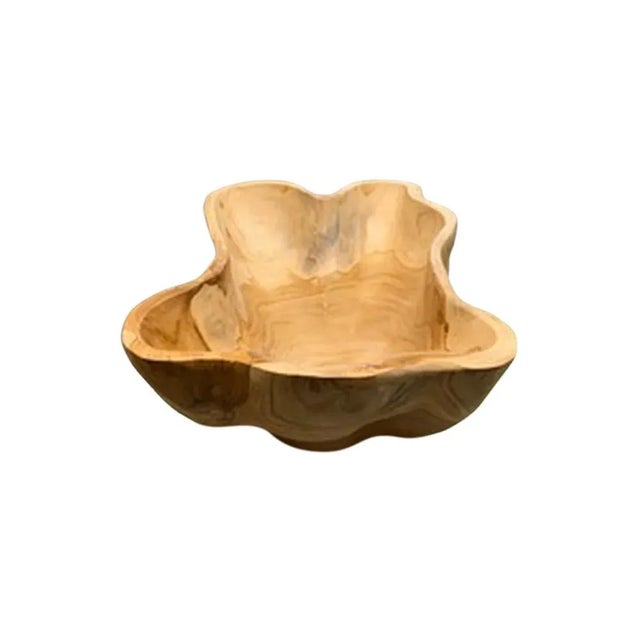 This teak live edge bowl is a unique piece showcasing the natural beauty of teak wood. Crafted by skilled artisans, its...