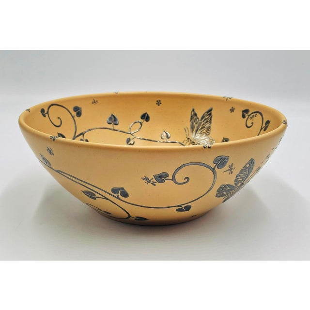 A charming porcelain and pure silver decorative bowl designed and handcrafted in Taxco, Mexico by celebrated artist Emilia...