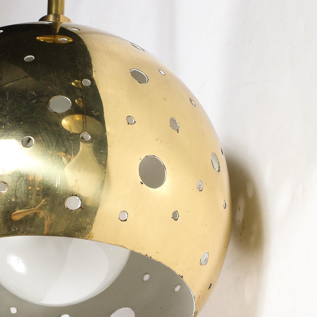 This exquisite Mid-Century Modernist brass pendant chandelier epitomizes the elegant design sensibility of the 1960s....