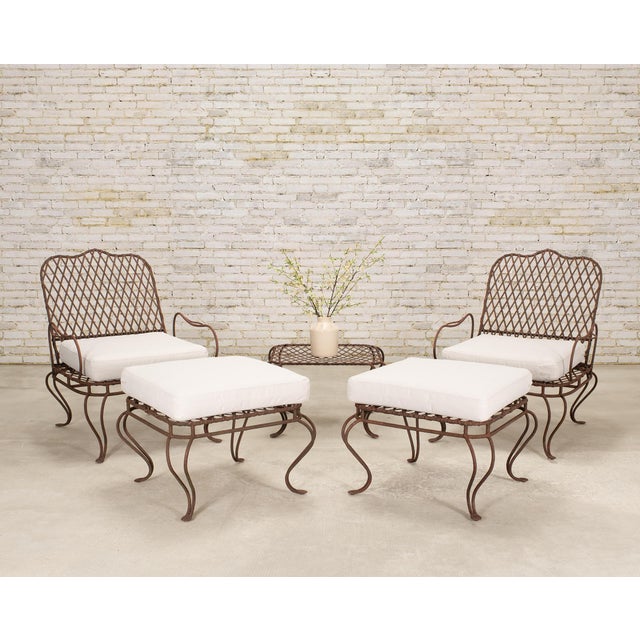 A whimsical pair of "Twig Iron" patio and garden lounge chairs designed by Rose Tarlow with two matching ottomans. The...
