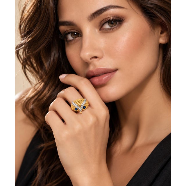 Make a captivating statement with this finely sculpted vintage figural owl ring, masterfully crafted in rich 14k yellow...