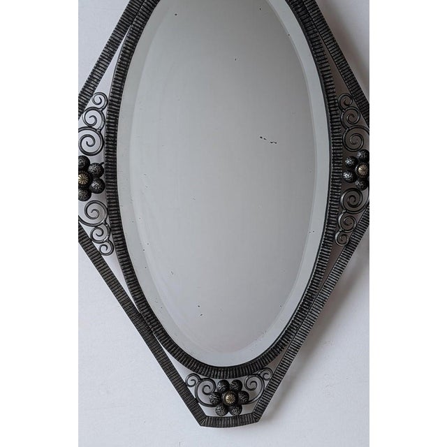French Art Deco wrought iron mirror signed by French artist "Elarcher" with intricate flower motif in its authentic patina...