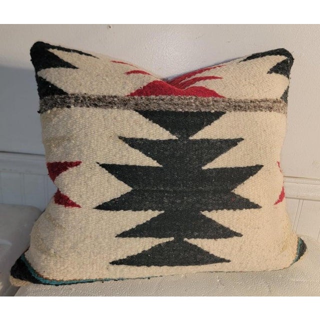 Pair of hand woven pillows with black linen backing. The inserts are down & feather fill. Sold as a pair.