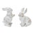 Add a touch of whimsy and sophistication to your home with this charming set of White Washed Rabbit Figurines. Made from...