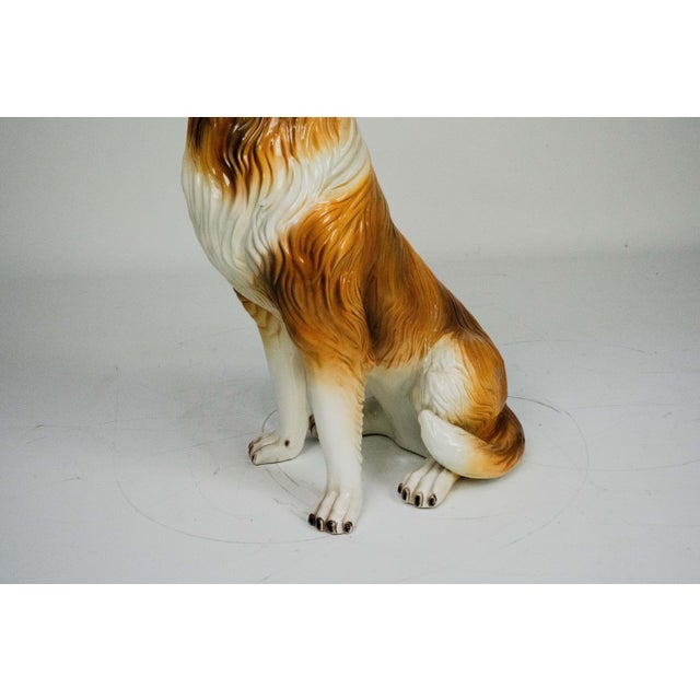 Elegant and finely crafted Italian ceramic sculpture depicting a seated Collie dog, produced in Italy circa 1970s. The...