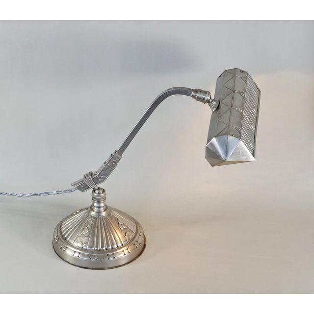MONIX A nice French art deco piano or desk lamp in nickel plated solid brass or bronze made around 1930. The shade partly...