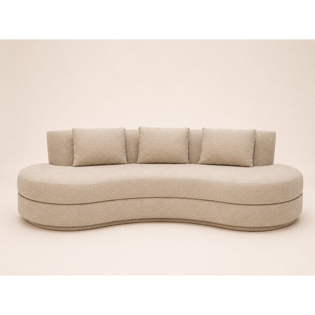 A perfectly rounded sofa with ideal proportions. Backrest and base in beige bouclé fabric. Large seat cushion and back...