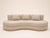 A perfectly rounded sofa with ideal proportions. Backrest and base in beige bouclé fabric. Large seat cushion and back...