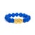 Saturated with oceanside blue and crowned with a guardian of luck, this beaded beauty marries talismanic charm with...