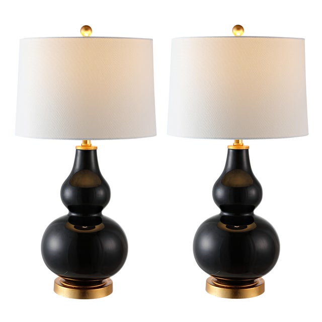 Illuminate your space with the Karlen table lamp set of two. Standing at 28.5 inches, these lamps offer an elegant blend...