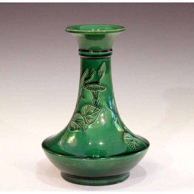 Antique Awaji bottle vase in deep green monochrome glaze with incised spray of well drawn bell flowers, circa 1910s....