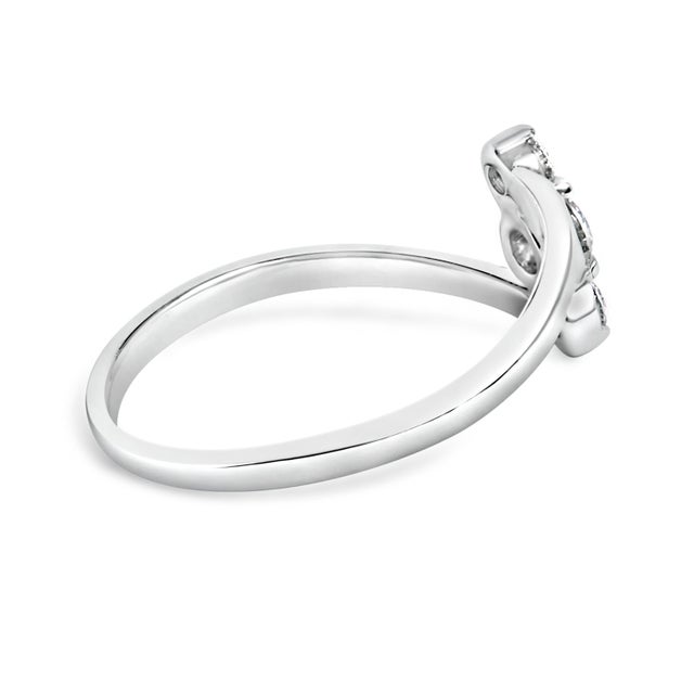 Discover elegance redefined with this exquisite ring, crafted in lustrous 10K white gold. Its smooth band graces the...