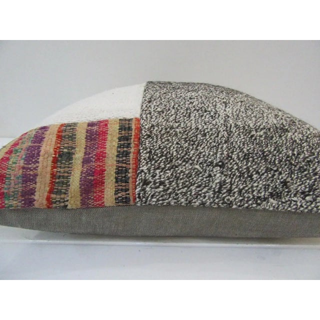 This is a pillow cover made from a vintage kilim rug. The piece was properly washed and ready to use. Pillow inserts not...