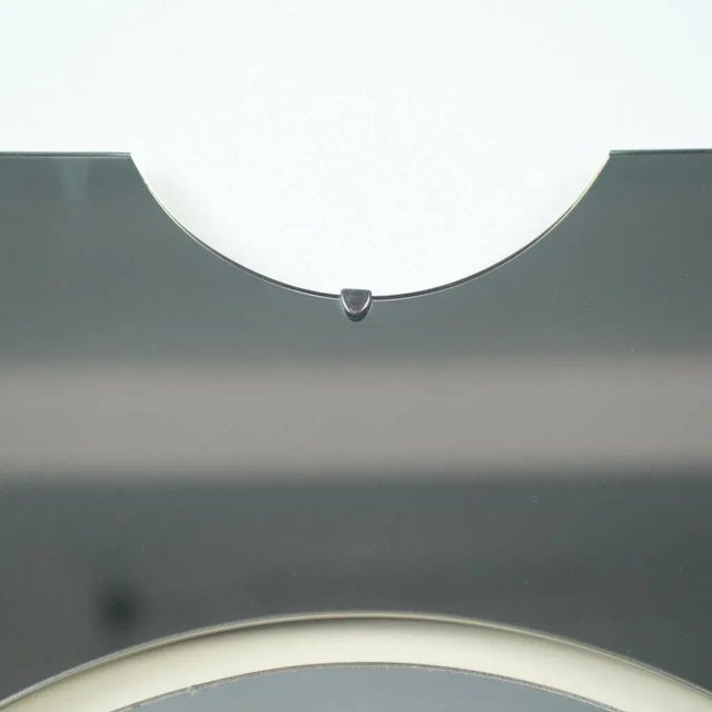 Rectangular mid-century mirror with small crescent in the upper central part. The back of the structure is made of wood,...