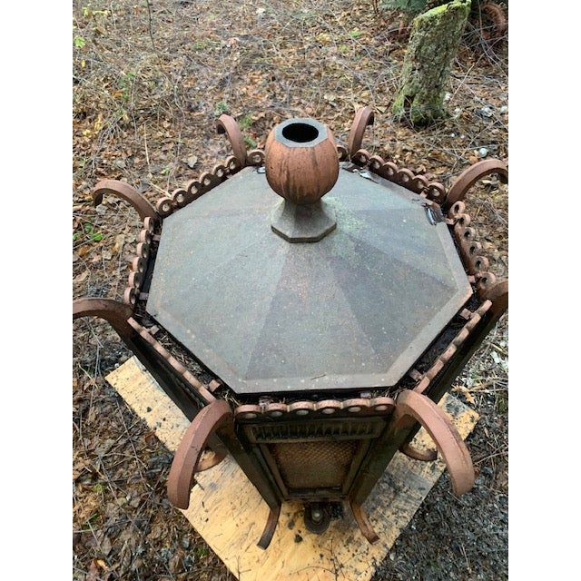 This is a massive vintage architectural lantern / courtyard lamp housing, constructed from heavy wrought iron with ornate...