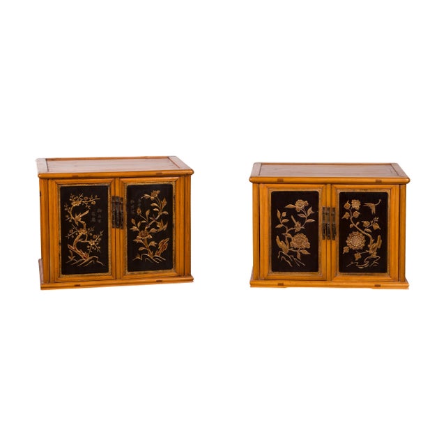Two Chinese Qing Dynasty period fruitwood stackable side cabinets from the 19th century with carved gilt motifs, priced...