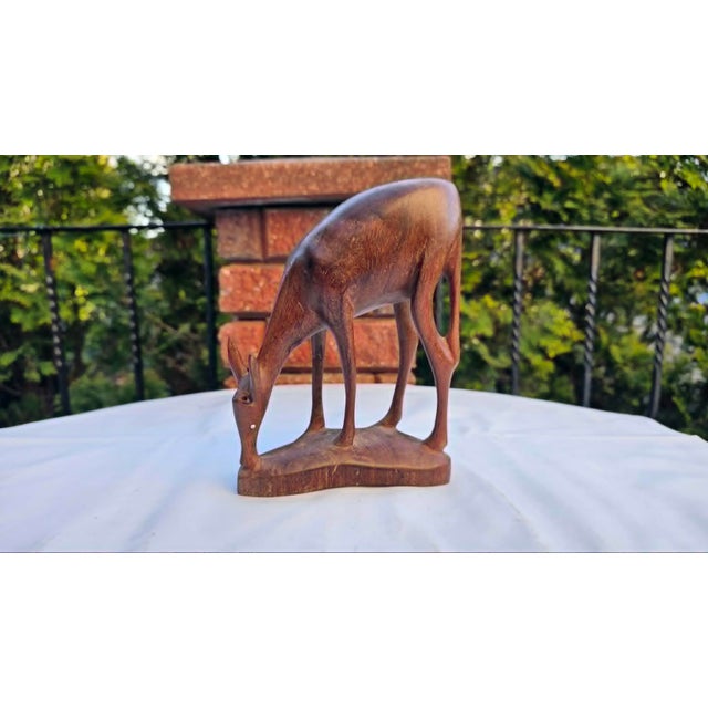 Wooden figurine, grazing deer, vintage 1960s-1970s, dimensions: height 20 cm, width 15.5 cm, depth 7 cm.