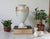 Vintage Neoclassical porcelain white and gold urn with female figural handles. No makers mark. Hairline crack. Pictured.