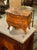 The product is a 19th-century French Louis XV miniature walnut commode. This piece is a decorative collectible item during...