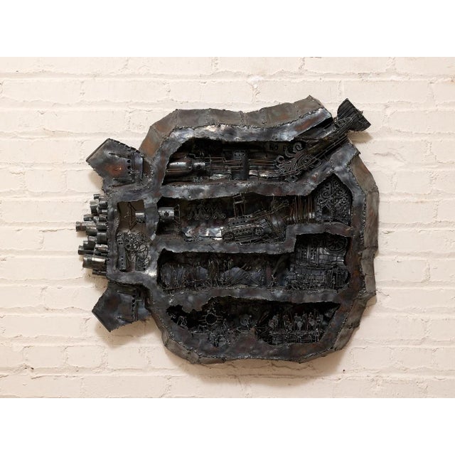 Vintage Metal Assemblage Sculpture is a fantastic vintage Brutalist wall sculpture constructed from layers of welded...