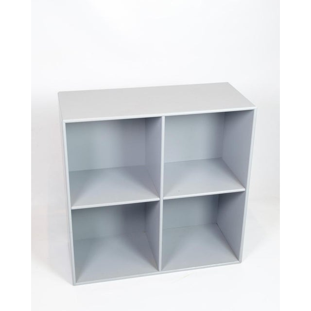 Grey Montana module with four large compartments, designed by Peter J. Lassen. Dimensions: H:70cm W:70cm D:30cm This piece...