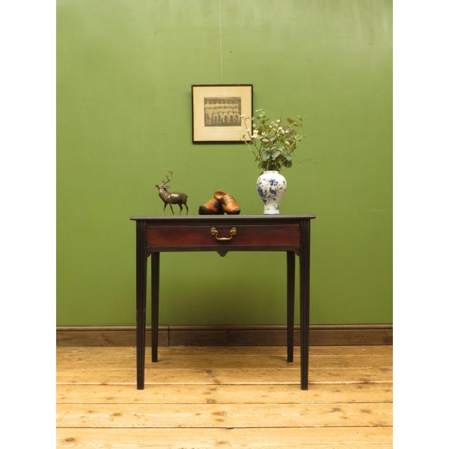 A useful small antique side table dating to the 19th century. made of mahogany and modestly sized it is ideal for a...