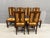 A sculptural set of 6 Brutalist dining chairs from 1950s France, defined by raw ash wood construction and handwoven straw...