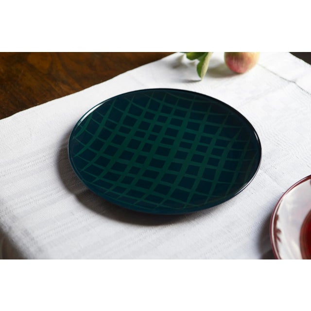 Network Blue is a plate in lacquered glass, using a precious and traditional Japanese lacquer called Urushi, and decorated...