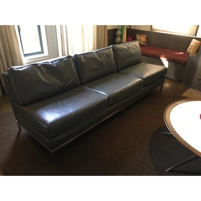 Classic 1960s Dunbar sofa. Gently used. Recovered in the grey leather in 2001. Minor scuffing on chrome legs. This is a...