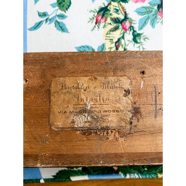 An exceptional antique Florentine giltwood frame bearing the original workshop label of Bartolozzi e Maioli, a respected...