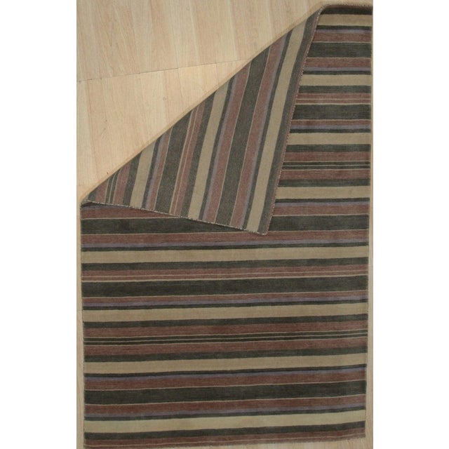 This multicolor jewel tone rug is a hand knotted pile floor covering crafted from wool. Designed in the EORC Rugs style,...