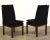A set of four mid century modern walnut parsons style dining chairs by John Stuart with black suede fabric. Seat height is...
