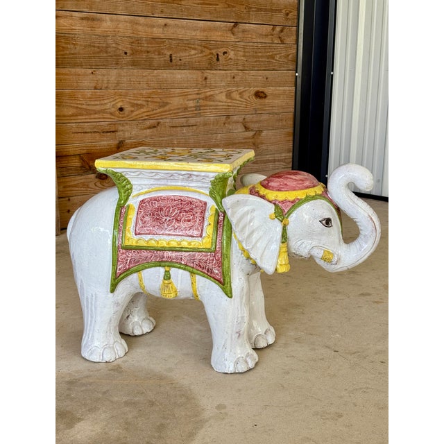 A monumental Mid-20th Century Italian glazed terra cotta elephant garden seat or side table bursting with charm and...